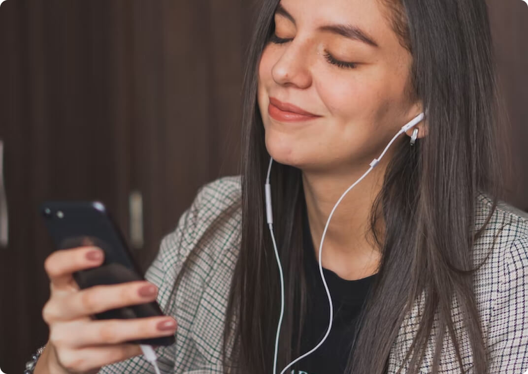 woman listening to music on headphones