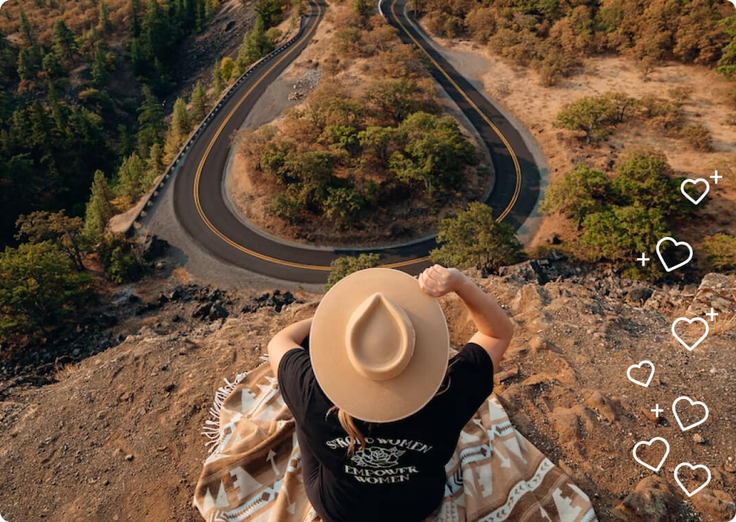 Female influencer overlooks scenic road view