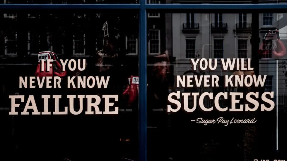 Image accompanying influencer marketing interview questions. A close-up shot of a window with a Sugar Ray Leonard quotation on it. Quotation reads: If you never know failure, you will never know success.