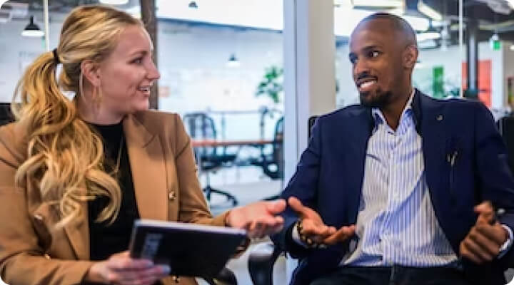 man and woman in partnership discussion