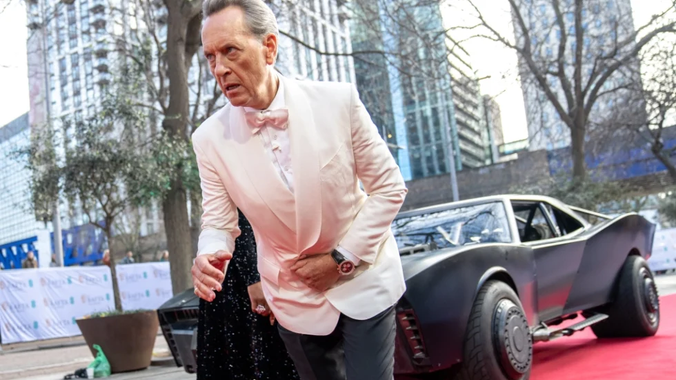 Richard E Grant arrives at the BAFTAs in the Batmobile