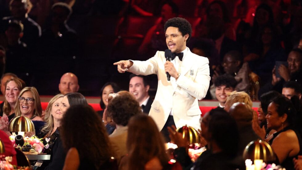 Trevor Noah standing in the crowd at the Grammys