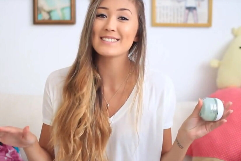An influencer showing a Loreal makeup product