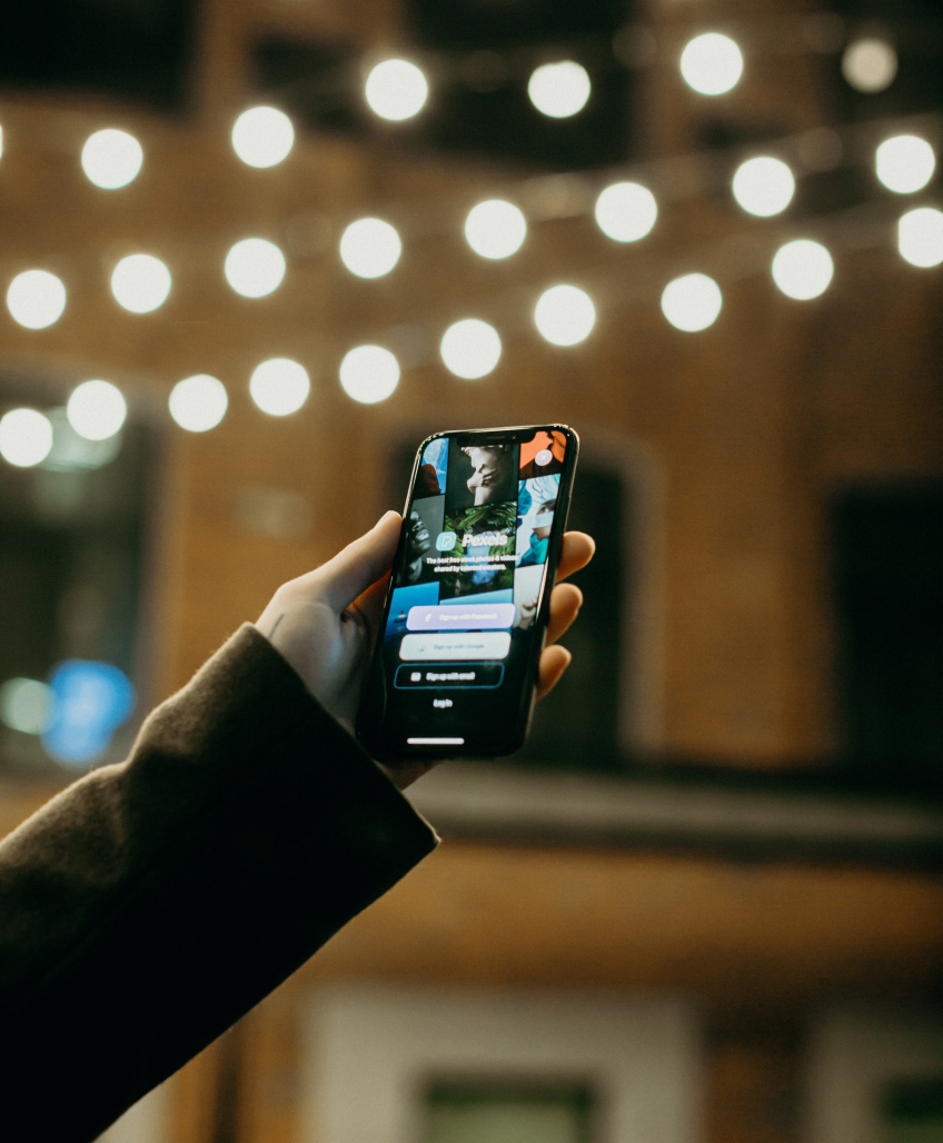 Holding a phone with lights above