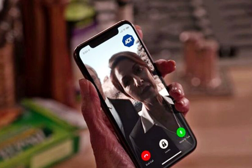 ADT app on phone on the series Grace and Frankie