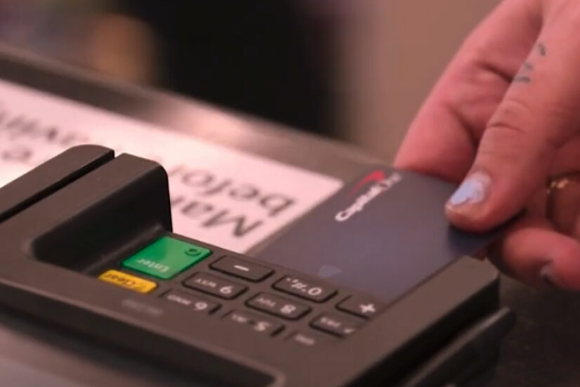 A person purchasing using a Capital One credit card