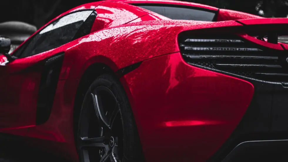 Automotive influencers: artistic shot of a red sports car taken from a low perspective