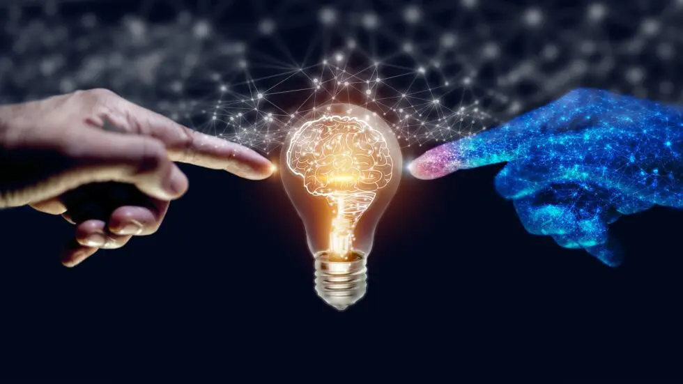 marketing AI automation: A human hand on the left, a digital hand on the right. Both touching a lightbulb with a filament that looks like a brain.