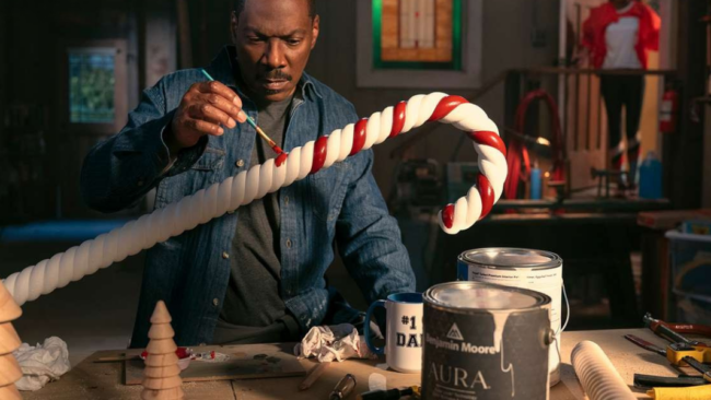 Benjamin Moore’s integration in Candy Cane Lane, seamlessly blending into the holiday film’s festive setting.